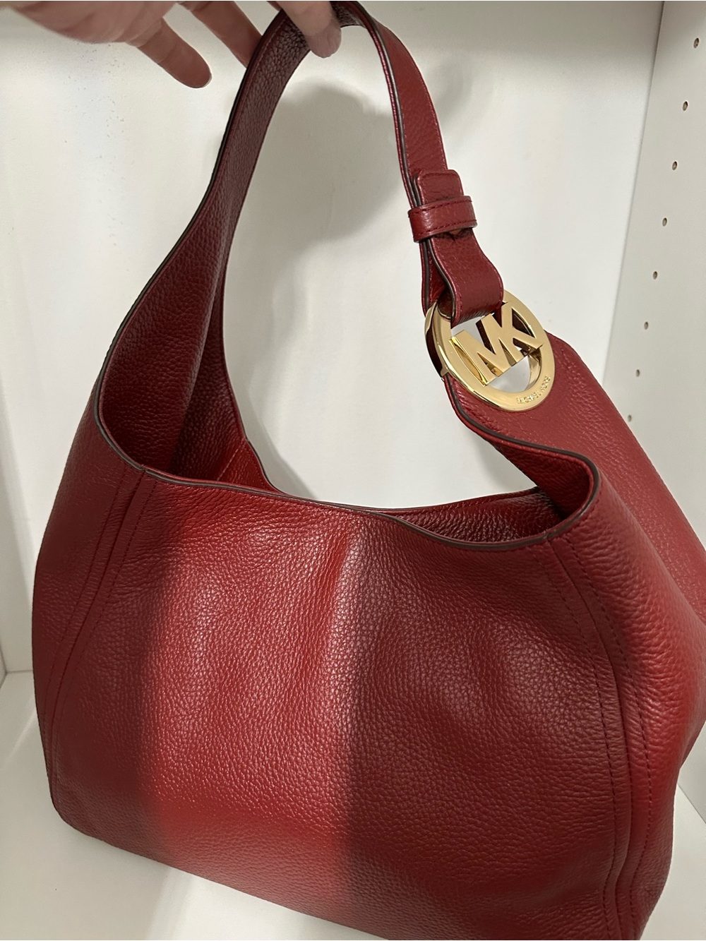 Michael Kors Fulton hobo in signature Terracotta with gold hardware.